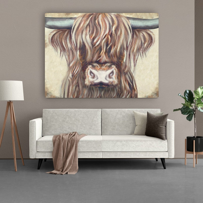 Het kleurrijke canvas schilderij hangt boven een bank in de woonkamer
