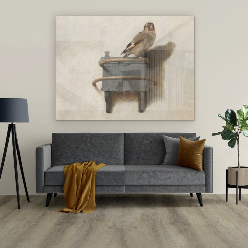 Het puttertje op plexiglas schilderij hangt hier in de woonkamer boven de bank. Dit Puttertje is gemaakt door de oude meester Carel Fabritius ten tijde van de Gouden eeuw. Hij maakte dit meesterwerk met de distelvink op een paneel.